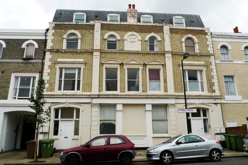 Taxi Service in East Dulwich, SE22 Three-storey townhouse with a decorative façade, parked cars in front.